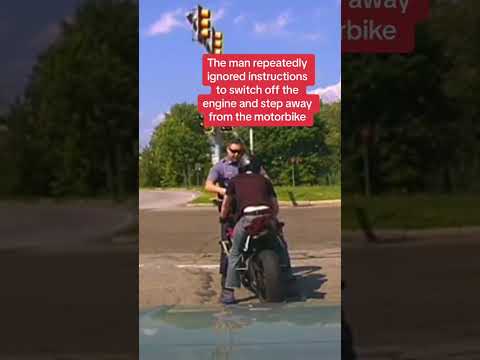 Cop pushed into traffic by motorcyclist