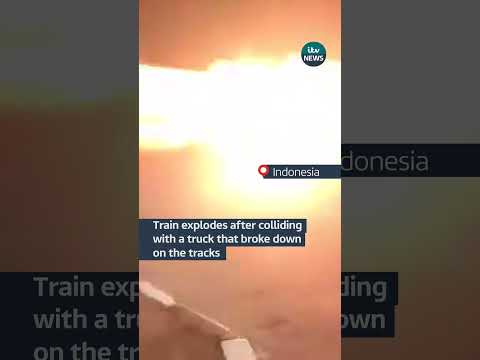 Train explodes after colliding with a truck that broke down on the tracks | ITV News