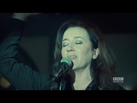 EXCLUSIVE! 'Orphan Black' Sneak Peek: Maria Doyle Kennedy Shows Off Mrs. S' Incredible Voice! - UCdtXPiqI2cLorKaPrfpKc4g