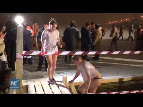 Russians take icy water bath to celebrate Orthodox Epiphany - UCHBDXQDmqnaqIEPdEapEFVQ