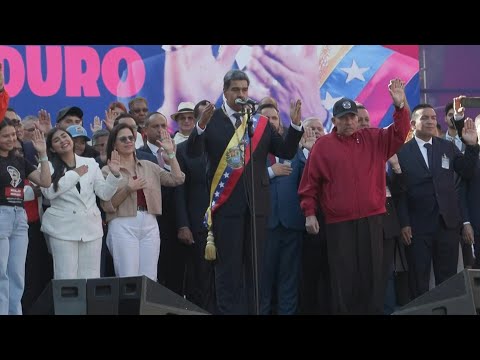 Maduro celebrates third term in office with supporters outside Miraflores presidential palace | AFP