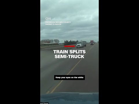 Train smashes into semi-truck as it turns onto the tracks