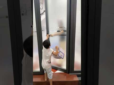 Try not to smile when you look at the door.