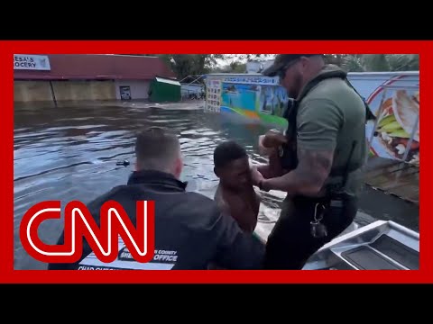 'He was waving us down': Sheriff describes rescue of boy floating on a piece of fence