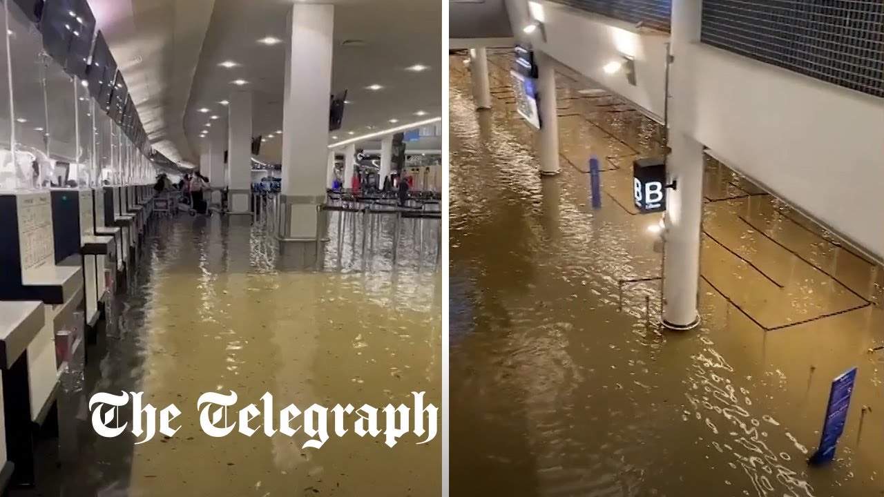 Auckland Airport terminal flooded knee-deep amid torrential rain in New Zealand