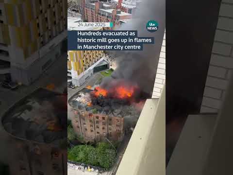 Hundreds evacuated as historic mill goes up in flames in Manchester city centre | ITV News