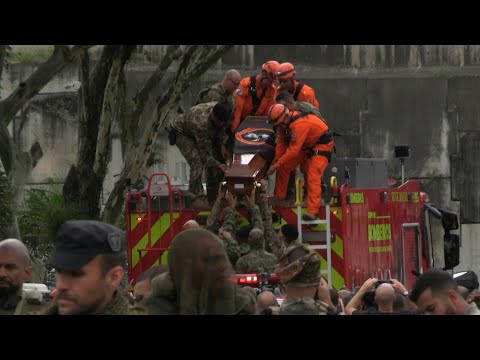 Relatives, friends, security forces attend funeral of sergeant killed during police raid | AFP