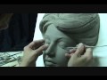 Sculpting female head in clay. Tutorial how to sculpt in a water