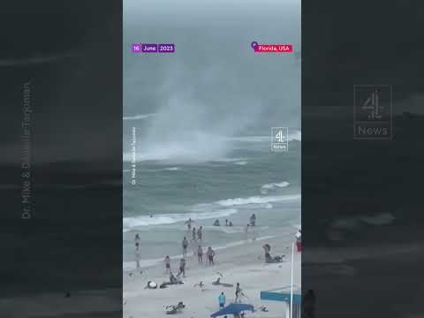 Waterspout causes chaos on Florida beach and injures two