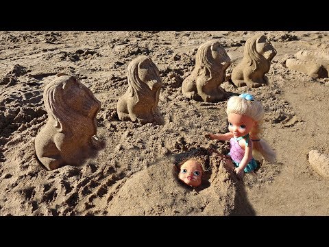 Elsa and Anna toddlers play in the sand - UCB5mq0ucfGe9dNCIC0s41QQ