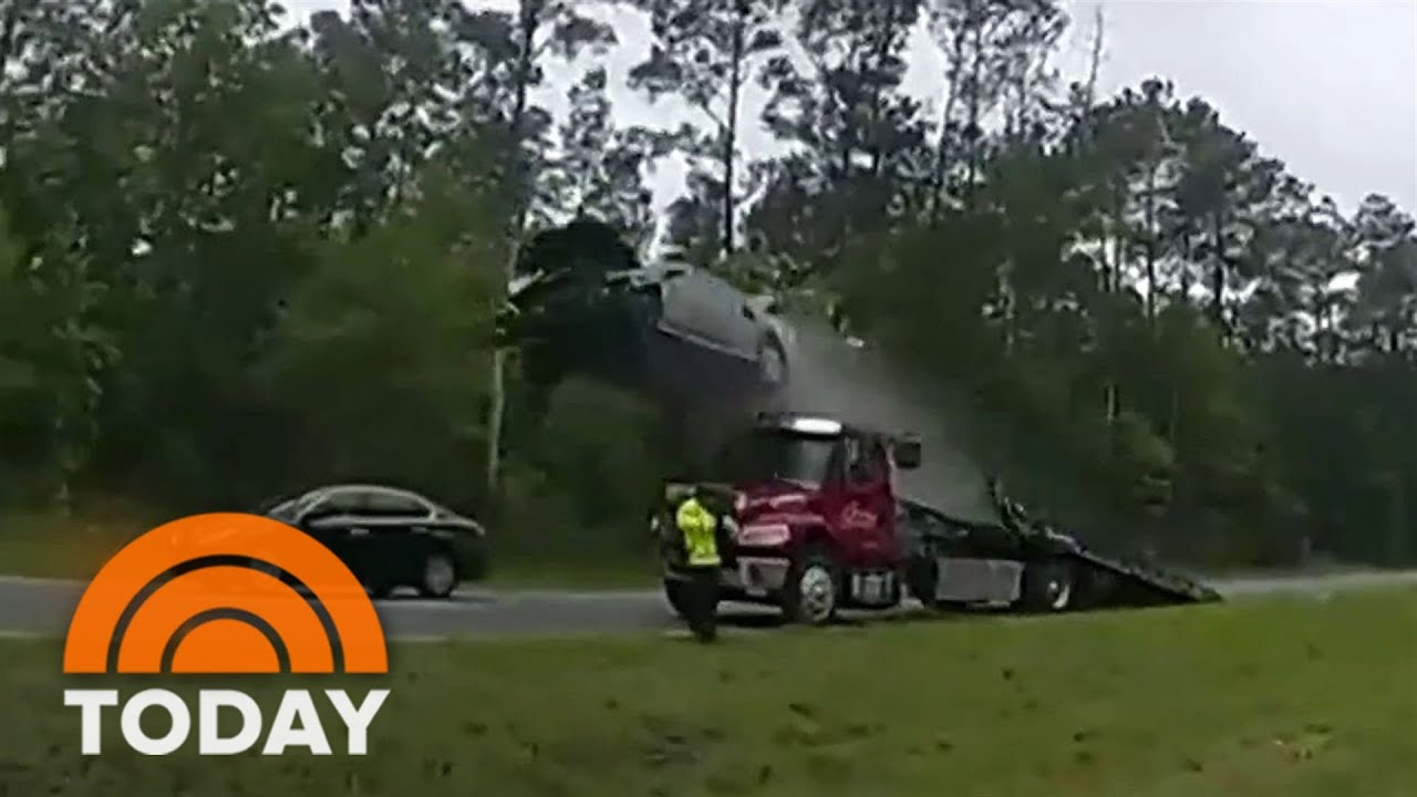 Car flies 120 feet after driving up tow truck ramp at full speed