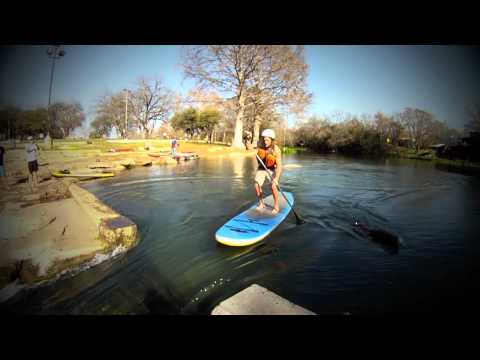 SUP down on San Marcos river rapid - UCTs-d2DgyuJVRICivxe2Ktg