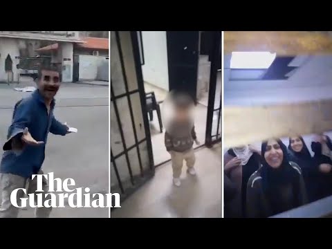 Men, women and children emerge from Sednaya prison in Damascus