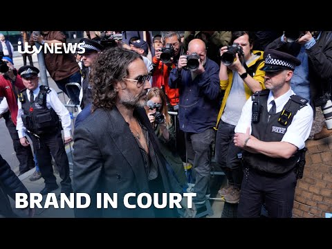 Russell Brand arrives at court and pleads not guilty to rape and sexual assault charges | ITV News