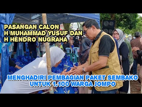 Pasangan calon H M Yusuf dan H Hendro, menghadiri pembagian paket sembako untuk 1.100 warga jompo