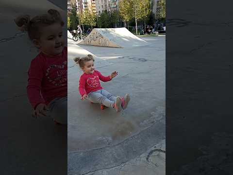 baby tries skateboard