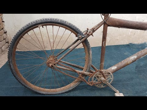 RESTORATION - A Villager Restoring Old Bicycle Wheel For Same other Bicycle