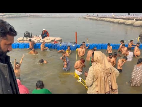 Devotees bathe in holy water one day after dozens were killed in festival stampede | AFP