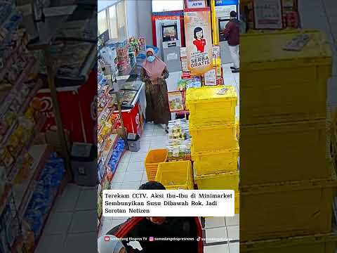 seorang ibu menyembunyikan dua kotak susu di bawah rok