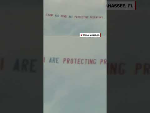 Protest banner flies over Epstein associate