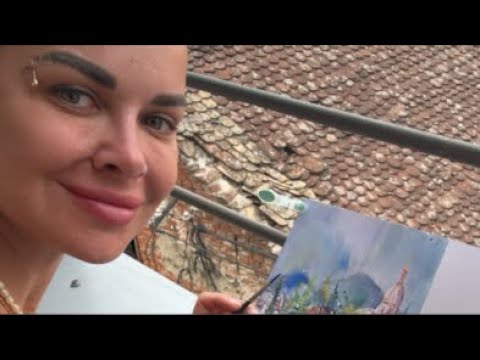 Sand Artist Kseniya painting on the rooftop in Serbia !