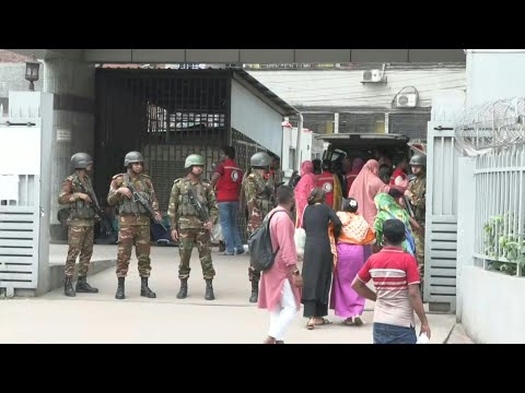 Soldiers stand guard outside Bangladesh hospital treating fighter jet crash victims | AFP