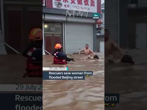 Rescuers save woman from flooded Beijing street #itvnews