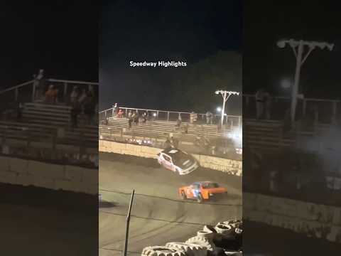 Stock car gets turn around and goes into wall backwards. - dirt track racing video image
