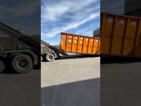 Picking up garbage container, 40 yard container, fill it with garbage.￼￼￼￼￼