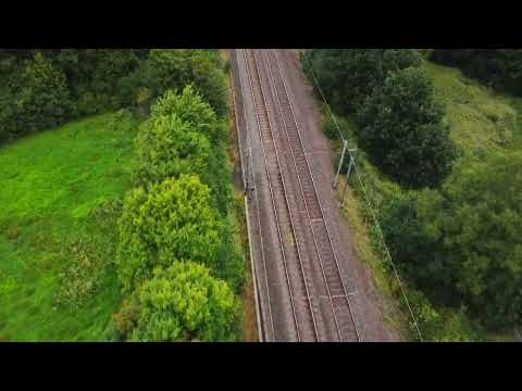Drone footage. West Coast Main Line Pendolino and Horses.