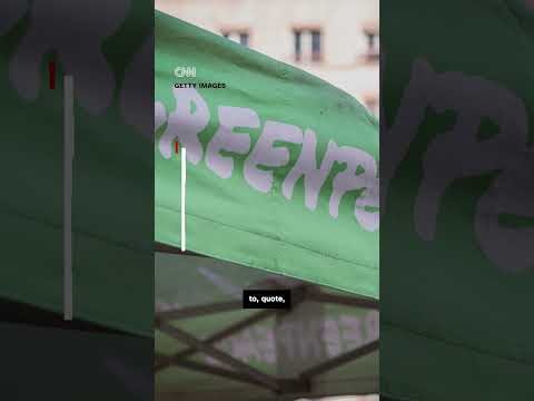 Greenpeace activists dye London's US Embassy pond red