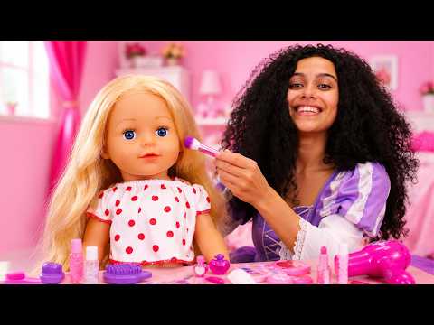Princesses play beauty salon with their baby doll.