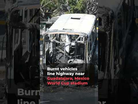 Burnt vehicles line highway near Mexican World Cup stadium | AJ #shorts