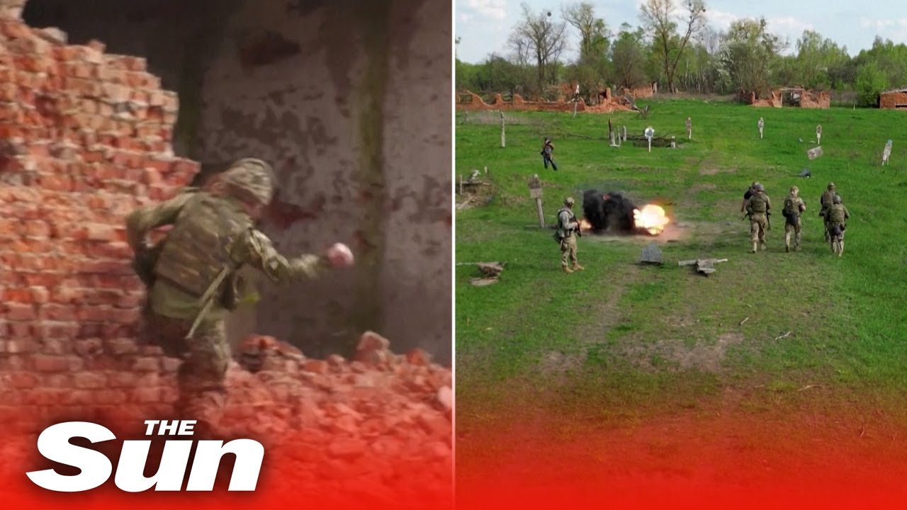 Ukrainian forces dodge explosions and throw grenades in military drills near Belarus border