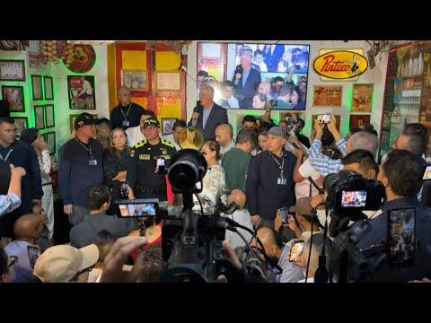 Former Colombian President Uribe, previously on house arrest, makes first public appearance | AFP
