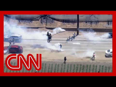 Watch intense standoff outside California farm between protesters and federal agents