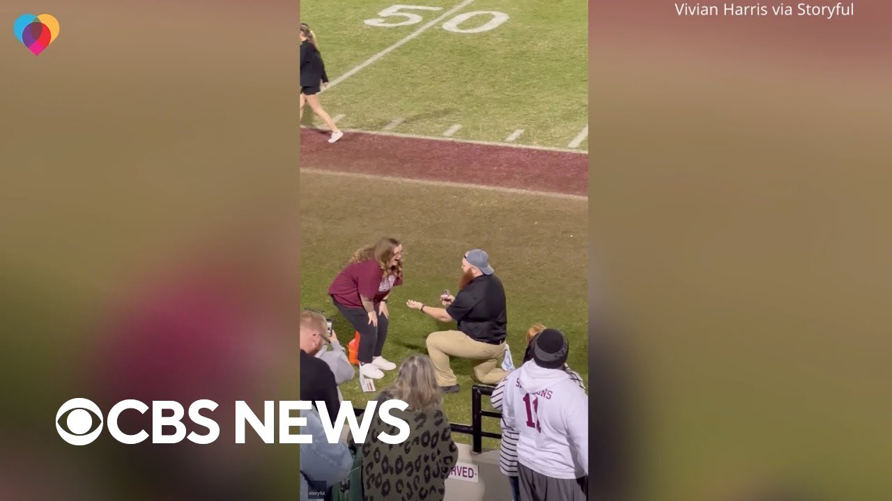 High school football team goes wild after coach proposes to girlfriend