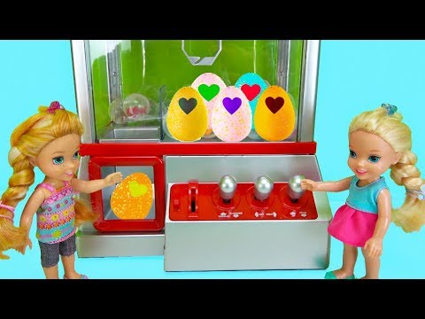 Elsa and Anna toddlers win Hatchimals from the claw machine - UCB5mq0ucfGe9dNCIC0s41QQ