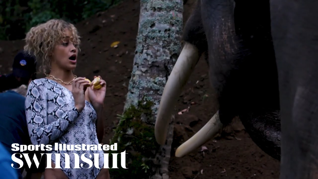 Jasmine Sanders Feeds Elephants | In The Wild | Sports Illustrated Swimsuit