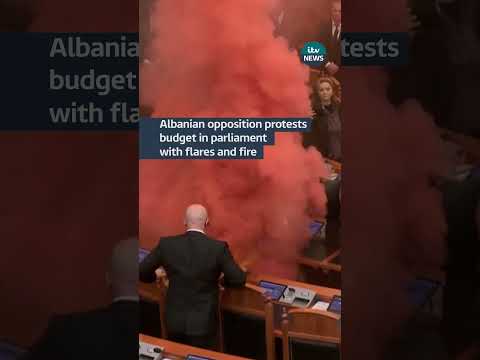 Albanian opposition protests budget in parliament with smoke flares and fire #albania #politics