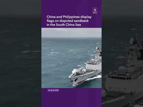 China and Philippines display flags on disputed sandbank in the South China Sea