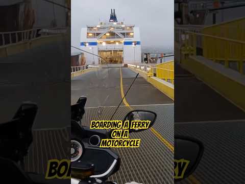 Boarding a ferry on a motorcycle.