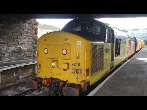 Colas Rail 37219 and 37116 slowly depart Carlisle working 1Q74 29/9/21