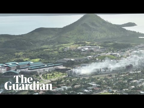 Drone footage of New Caledonia capital shows damaged building as Macron arrives