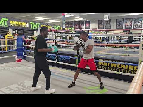 Prospect Dion Jones gets in work with his trainer Jeff Mayweather