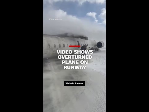 Video shows overturned plane on runway