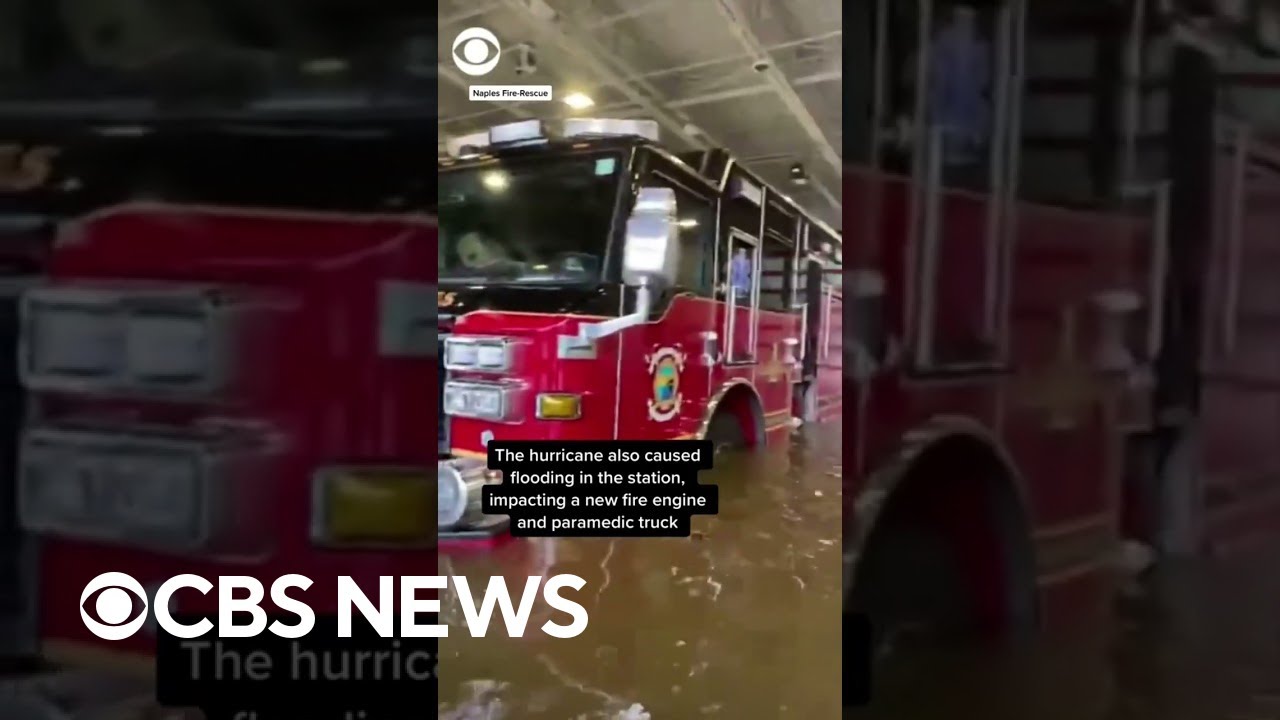Firefighters in Naples, Florida, wade through water as Hurricane Ian floods fire station #shorts