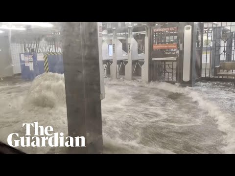 Footage shows flood water gushing into New York subway station during heavy rain