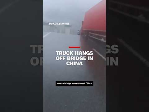 Truck hangs off bridge in China