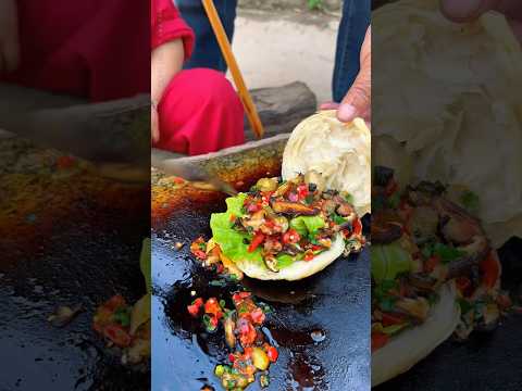 Chinese burger Stir-fried King Oyster Mushrooms on a Stone Slab